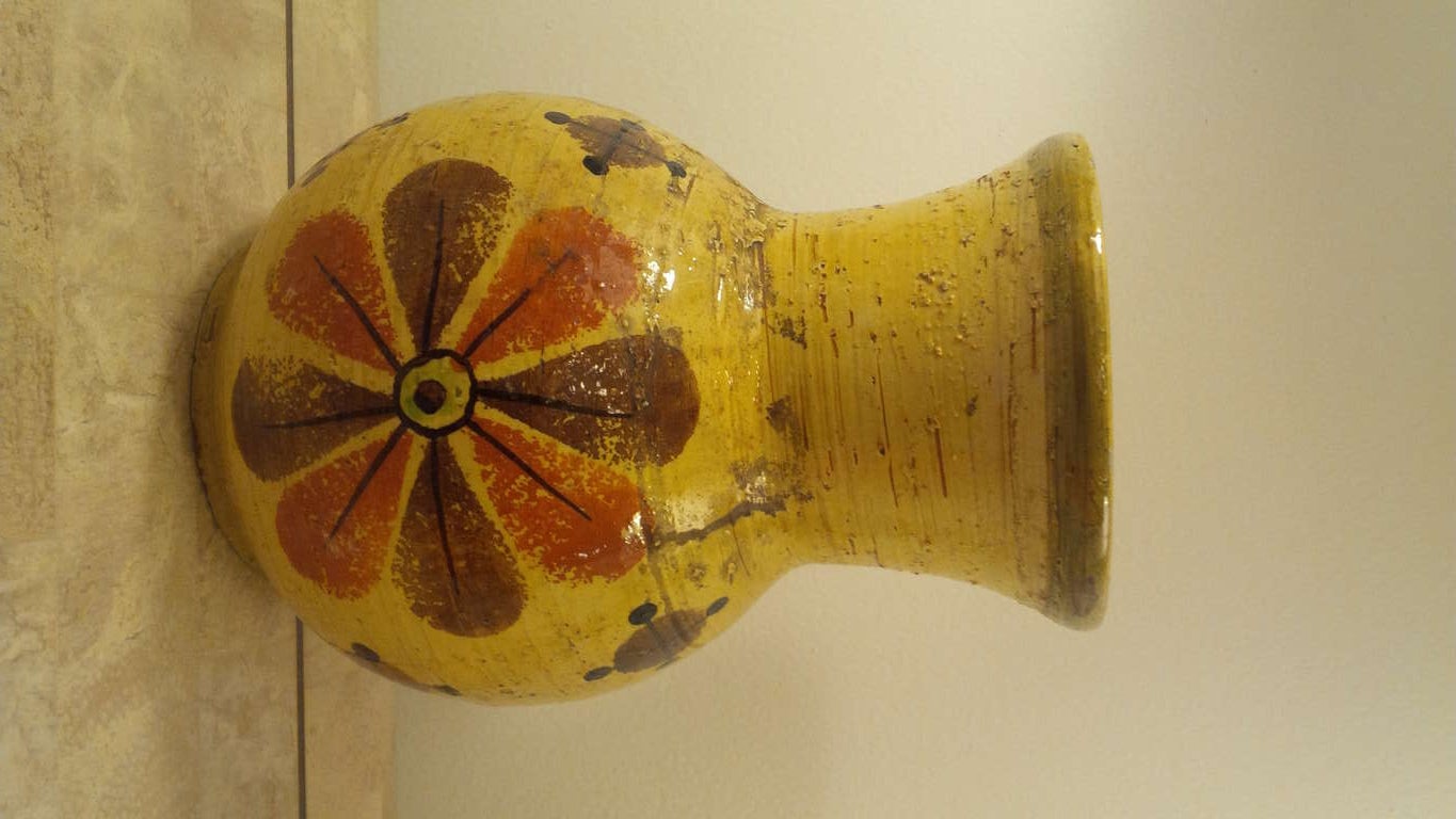 Yellow pottery vase with floral design by Rosenthal Netter. Signed.   Italy, circa 1960.