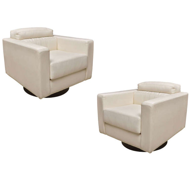 Pair of White Leather Swivel Arm Chairs in the style of Milo Baughman