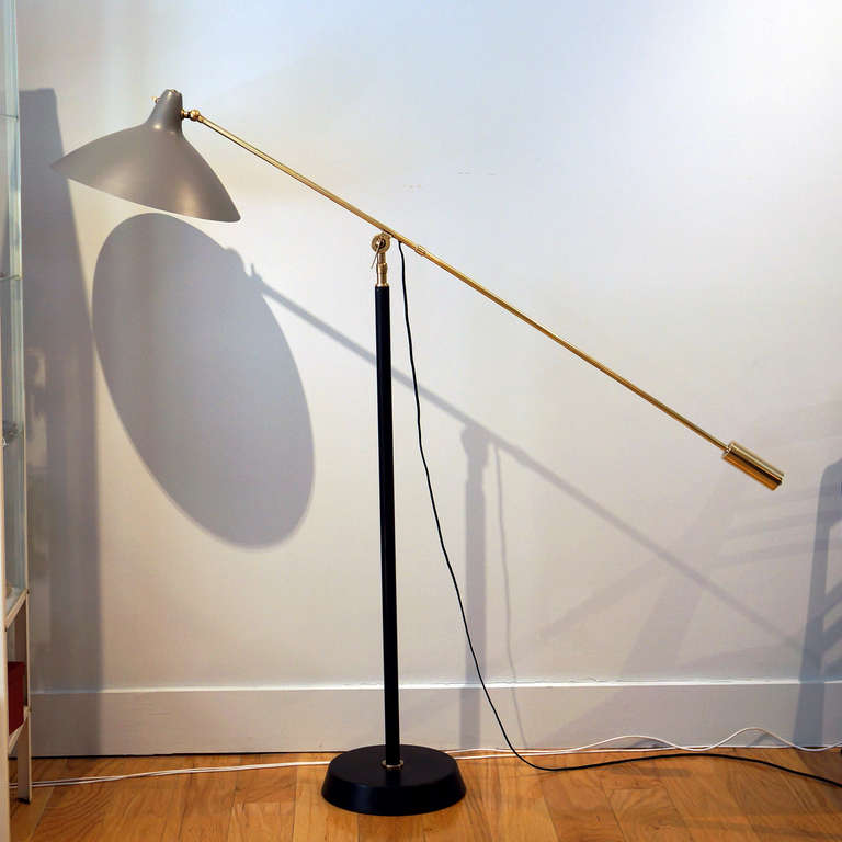 Adjustable floor lamp, towering scale. Single, counter balanced 55