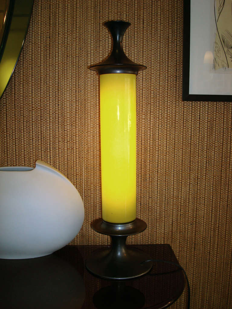 Desk lamp by Vistosi
Italy, circa 1960
column-form lamp by Vistosi. Deep green glass shade with dark patinated metal fittings. Recently rewired, takes standard tube bulb.

Overall excellent condition.
Measure: 22