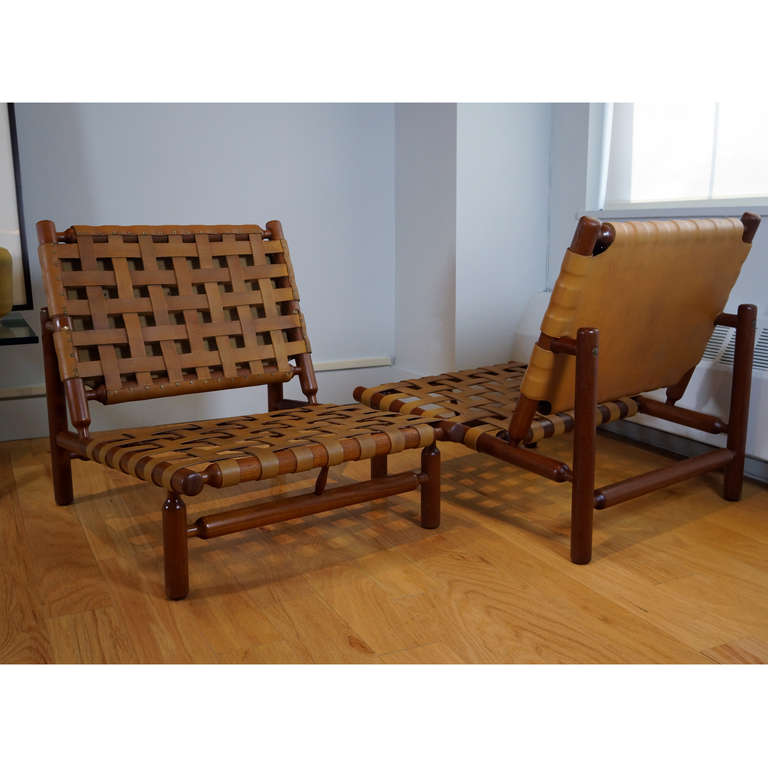 Pair of Lounge Chairs by Ilmari Tapiovaara
Italy, 1957

Designed by Ilmari Tapiovaara for the second annual Selettiva di Cantu, the annual exhibition of the Esposizione Permanente Mobili Cantu, 1957.
Solid teak with natural leather strapping