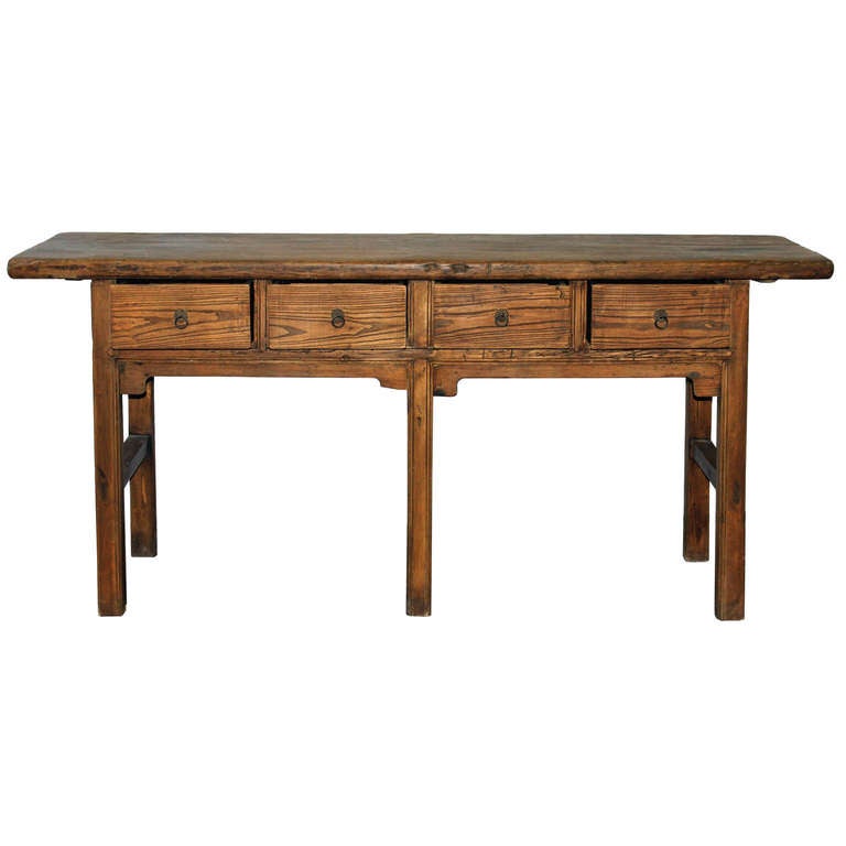 Four-drawer console table with beautifully grained elm wood. Sturdy table has solid elm wood top with simple skirt below the drawers and support bars on the sides. Display behind a sofa or in an entryway. Shanxi, China circa 1890s.