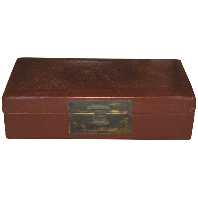 Antique leather box features a pattern of interlocking gold coins for prosperity. Decorated in two tones of gilding on a cinnabar background with classic 
