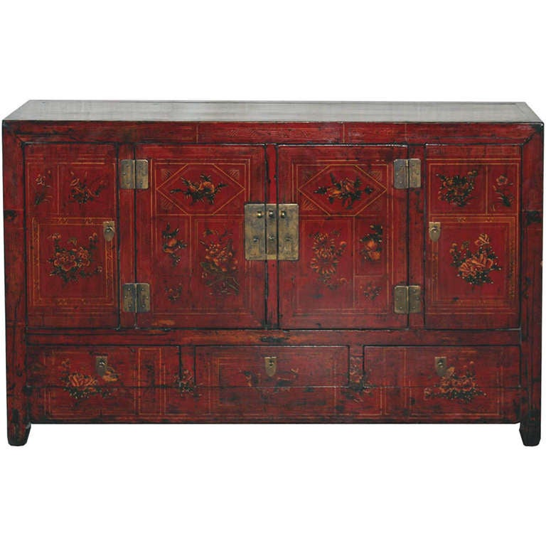 Late-19th-century red lacquered wedding buffet with hand-painted flowers, fruits and fish symbolizing happiness and prosperity for the newlyweds. Ample storage for dishes or entertainment equipment. New interior shelf and hardware. Circa 1870s.