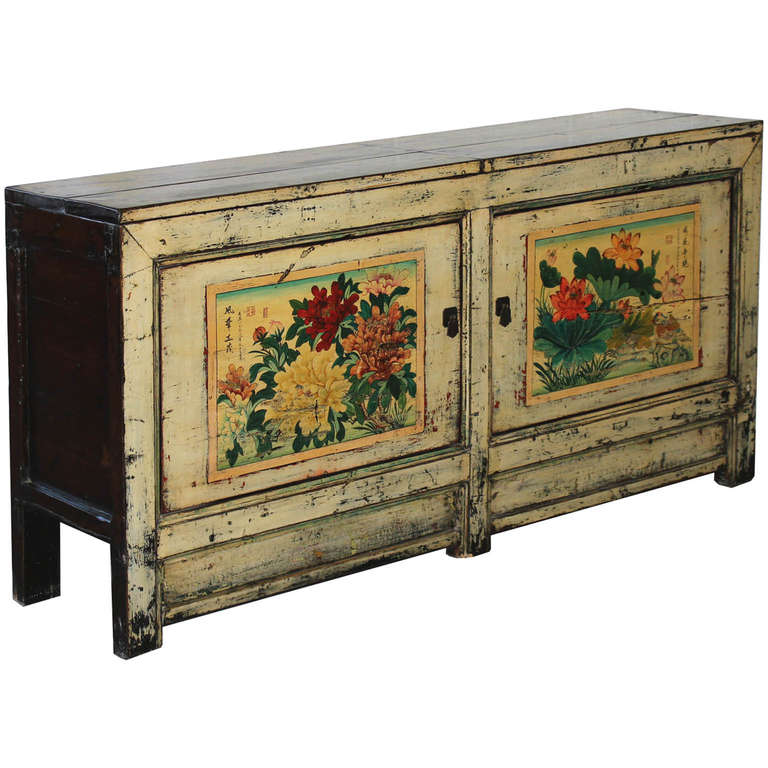 Elegant cream lacquer buffet with hand-painted bird and lotus and peonies flowers on the doors. Top opens up for easy storage. New interior shelves and hardware. Gansu, China circa 1880s.