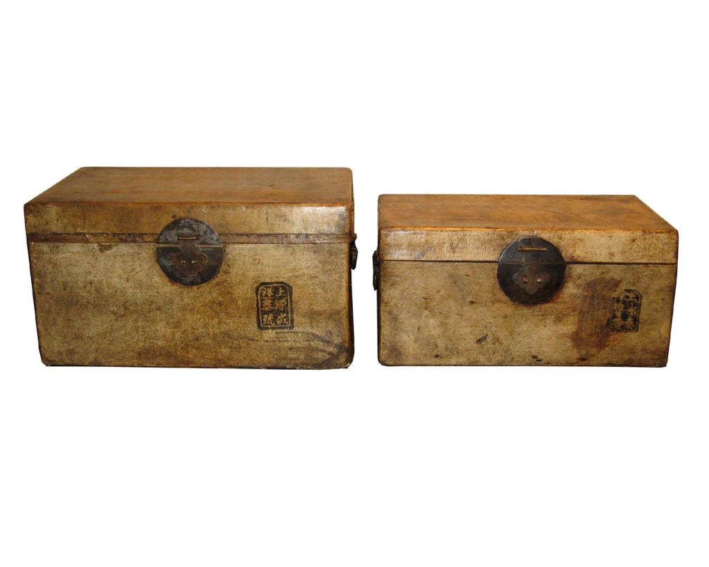 Antique cream color pigskin leather boxes from the Shanxi province in China.  The chop on the front of the box is the signature of the craftsman.  Priced and available individually.  Dimensions of smaller box - 14w x 8d x 7h $395