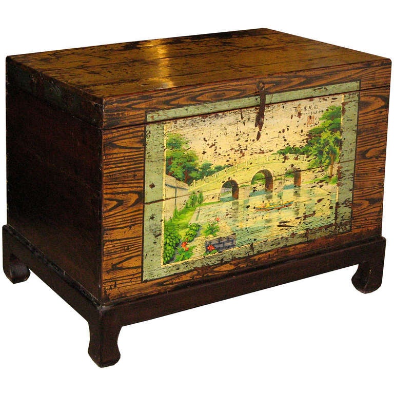 Trunk with hand-painted scene of a stone bridge with boats. The custom made wood stand was made to fit the trunk for use as a coffee or side table. Beijing, China, circa 1900s. 