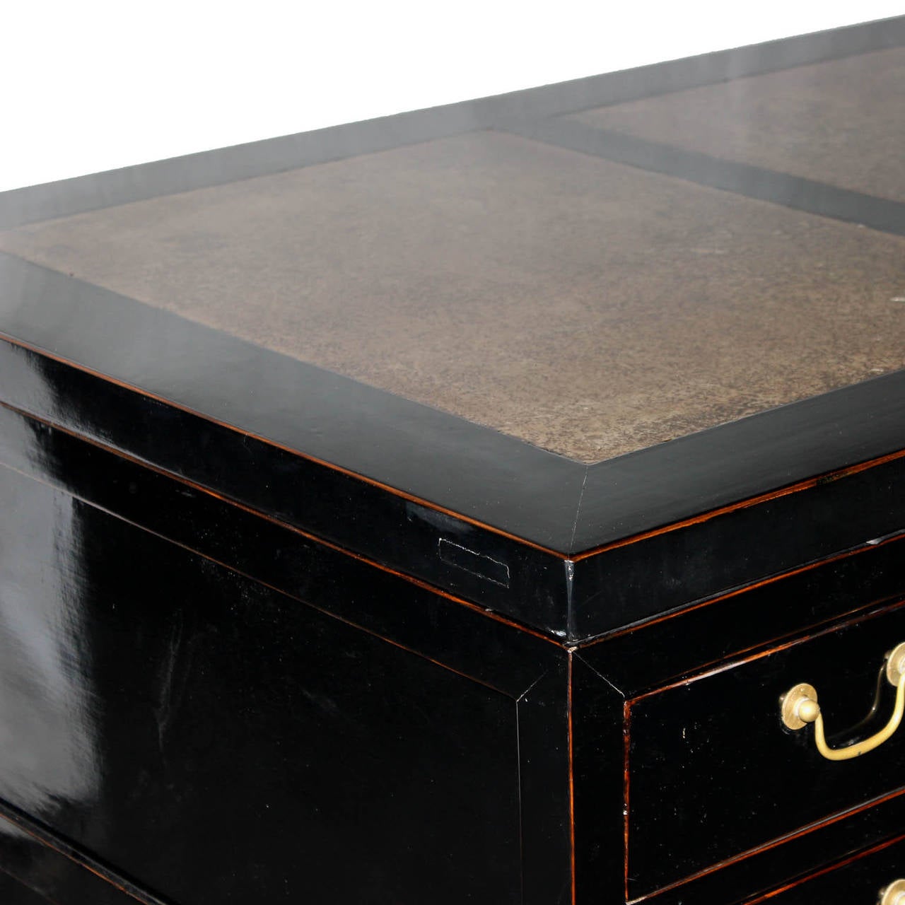 Contemporary black lacquer desk with exposed wood edges and stone top separates into three pieces for easy installation. Handsome desk can be placed in an office or a bedroom.