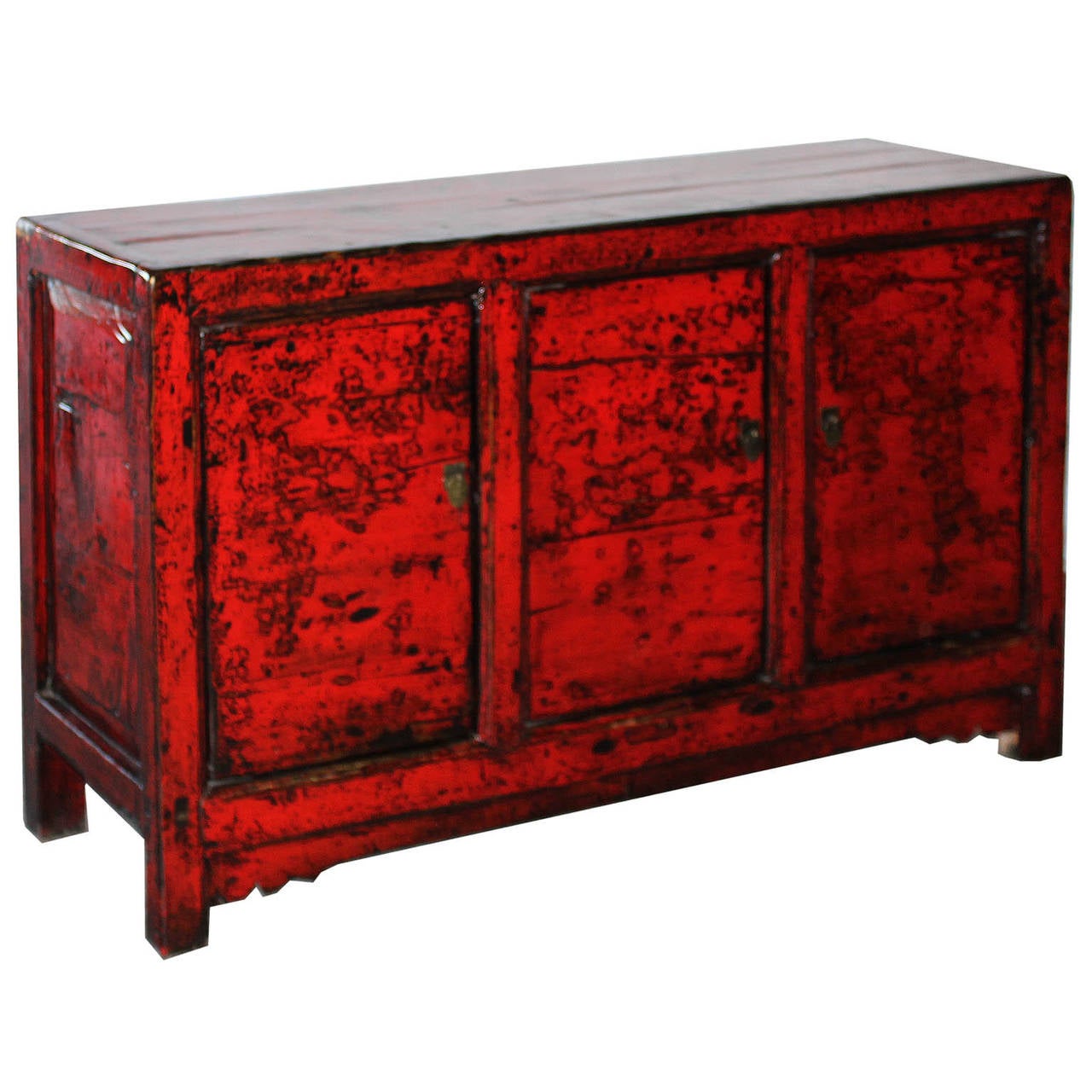 Three-door vintage sideboard with carved bottom skirt and exposed wood edges add a pop of color in the living or dining room in a contemporary interior. New interior shelf and hardware. Gansu, China, circa 1890s.