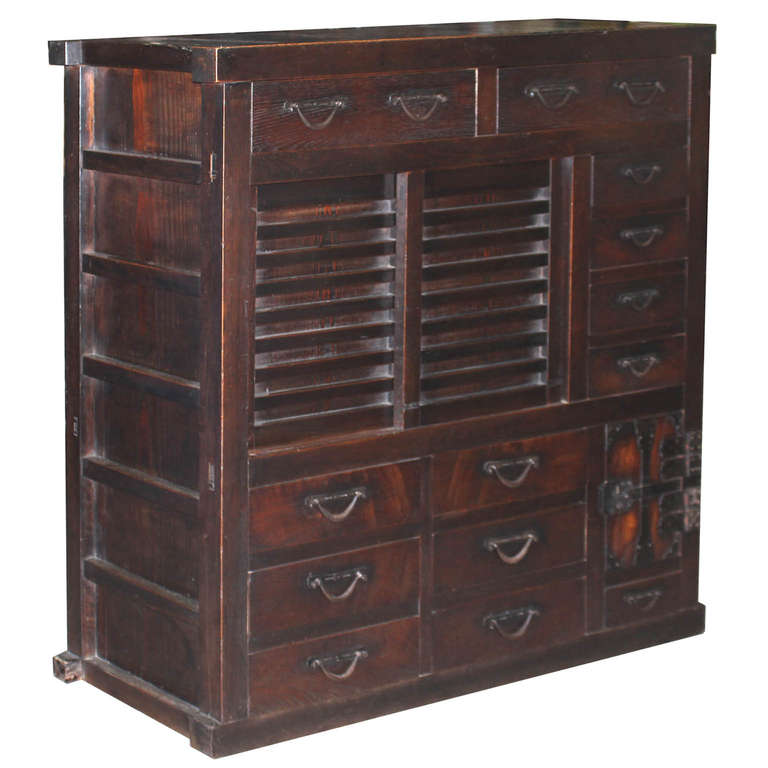 Very unusual and elegant Japanese merchant’s chest with multiple drawers from Kyoto, Japan. Richly grained keyaki wood panels and drawer fronts with cedar interior, top, sides and back. Original iron hardware. Great chest to display in an entry way