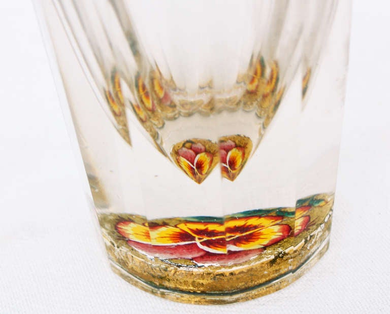 A rare and exceptional shot glass made of very high quality  cut crystal with a flower decorating the base with gilt highlights.