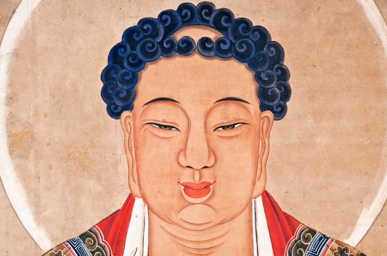 A large and beautiful Mid-Ching dynasty painting of Buddha dating to the mid-19th century. Recently laid on acid free paper and mounted on a wood and paper screen with silk accents. In his hand is positioned in a Prithvi mudra meant to inspire