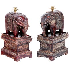 Pair of Chinese Carved and Lacquered Elephant Candle Holders