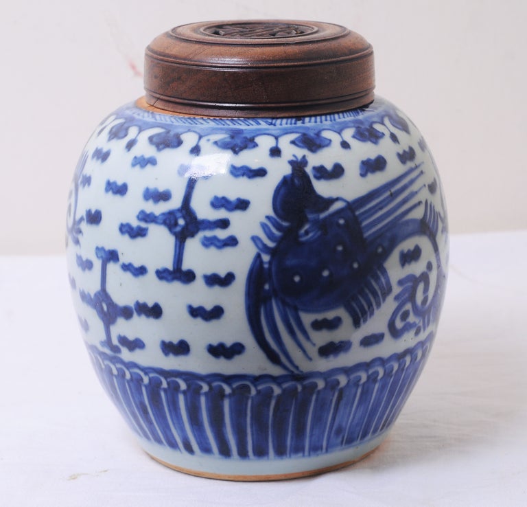 A rare early Chinese Blue & White ginger jar.  Great sapphire toned cobalt painted on a classic light blue porcelain ground.  Wood lid is associated and later.