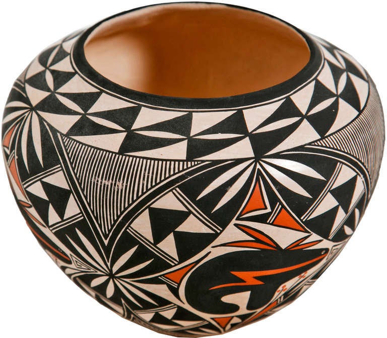 Native American (Acoma) pot by G. Patricio.  The bulbous pot decorated with painted designs of bears and geometrics in black and terracotta colors.

From the collection of R. F. Schwarz, a seasoned dealer of fine porcelain and objects, leading