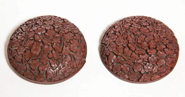 Hard to find early cinnabar box - covered round with all over intricate carving of plum blossoms.  Made in China around 1680. A marvelous little treasure.

From the collection of R. F. Schwarz, a seasoned dealer of fine porcelain and objects,