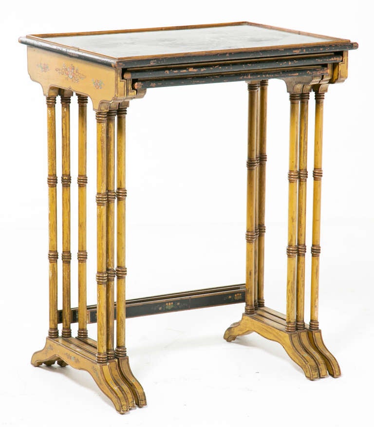 A Classic set of three nesting tables decorated in lacquer with Chinese themes. These useful tables where first made circa 1790. This set comes from England and dates from about 1910. They are great next to chairs or to serve. I like to think of