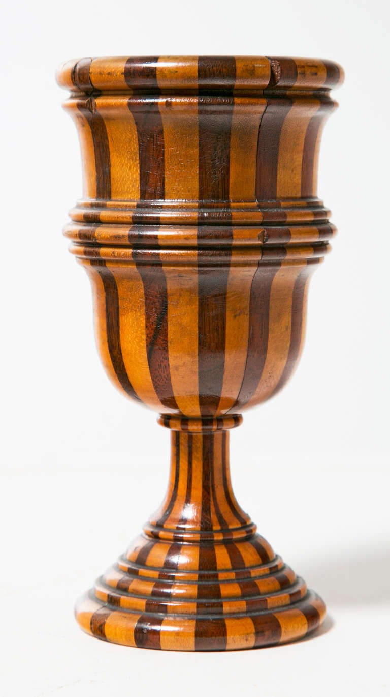 A rare and handsome example of Victorian Treen where joined wood was turned to create these unusual carvings.  This pieces has some small losses as shown where wood has flaked  or chipped away.