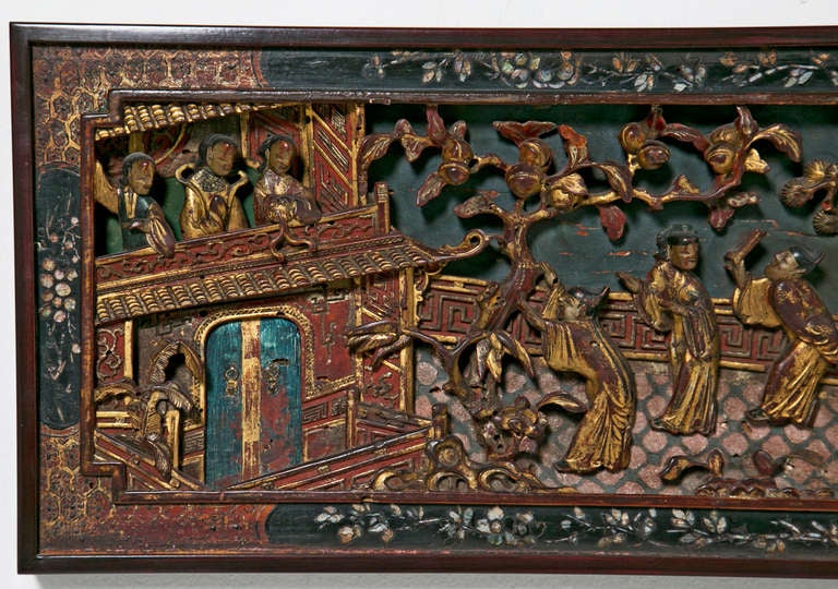Wood panel with carved pavilion scene with figures in a balcony and a garden with peaches and pine trees; surrounded by an inlaid mother of pearl frame.

From the collection of R. F. Schwarz, a seasoned dealer of fine porcelain and objects,