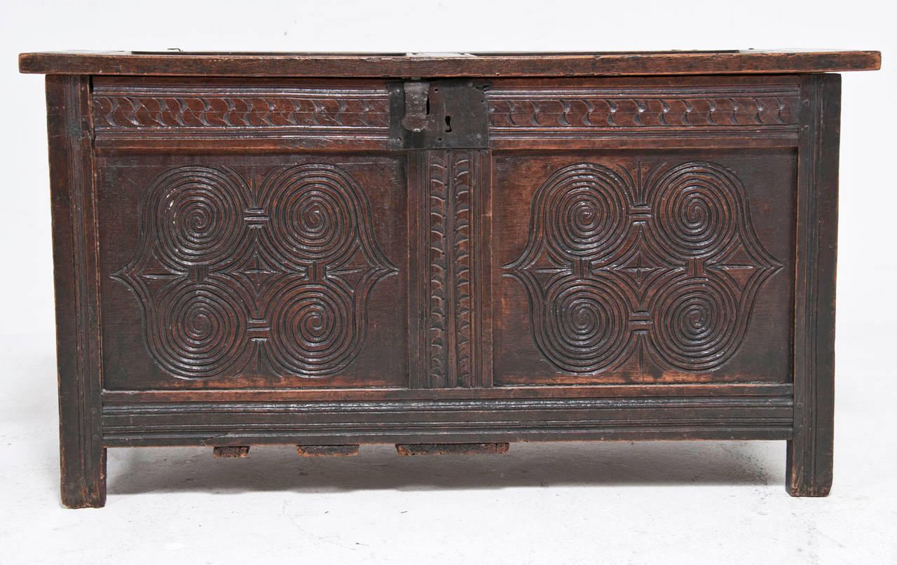 We like this piece particularly for its wonderful old surface and the Celtic motif that decorates the inset panels. Originally pieces like these where meant to protect a families valuables. Today they are used for storage and decoration. Great as a