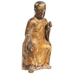 A Chinese Gilt and Lacquered Wooden Household God
