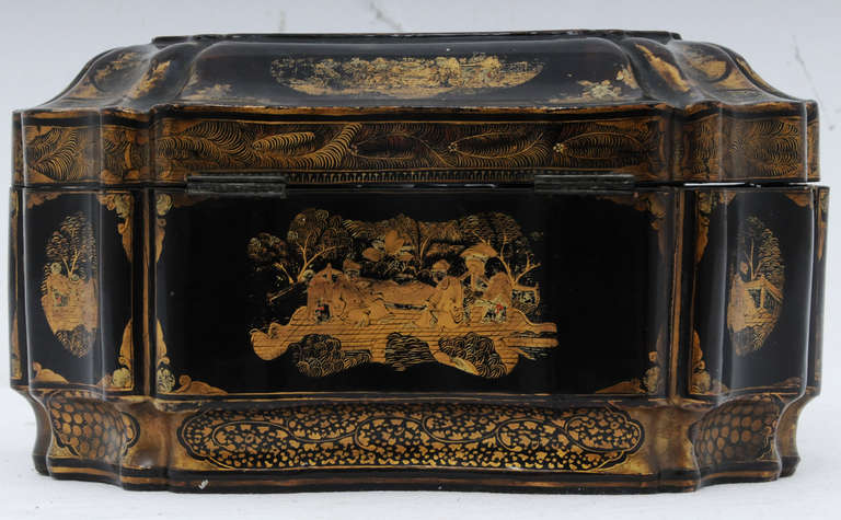 A wonderfully shaped painted and gilt Chinese Export tea caddy with original pewter liners and covers.  Made about 1840.   Nice overall condition and a very rare elaborate shape.