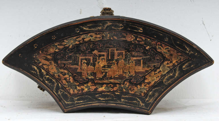 A very unusual Fan shaped Chinese export lacquered box in unusually good condition with substantial original decoration, made about 1860.