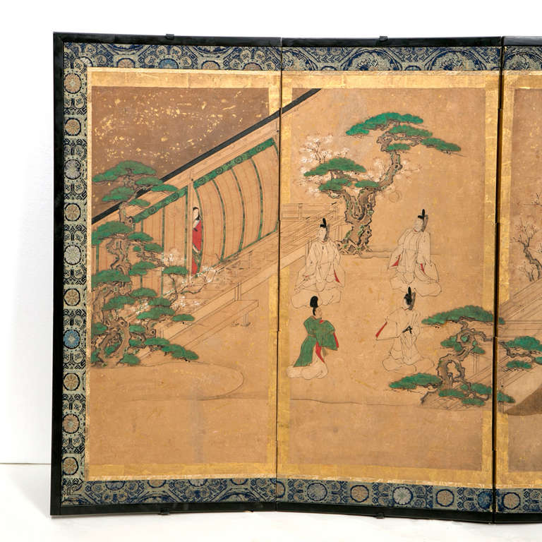 A very beautiful hand painted and gilt Japanese screen in the rare smaller size.  This most probably  illustrates scenes from the Tales of Genji a noted favorite  love story.  This is a rare smaller size.  Pieces like these where used to create
