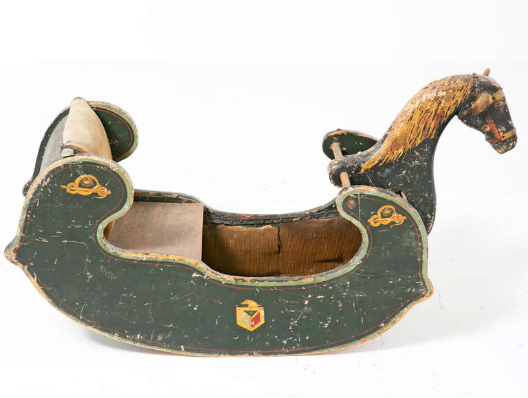 A charming early 19th century English rocking horse or sled with original painted and gilt decoration. A charming and rare survivor in original condition. Great example of Folk Art, circa 1820.