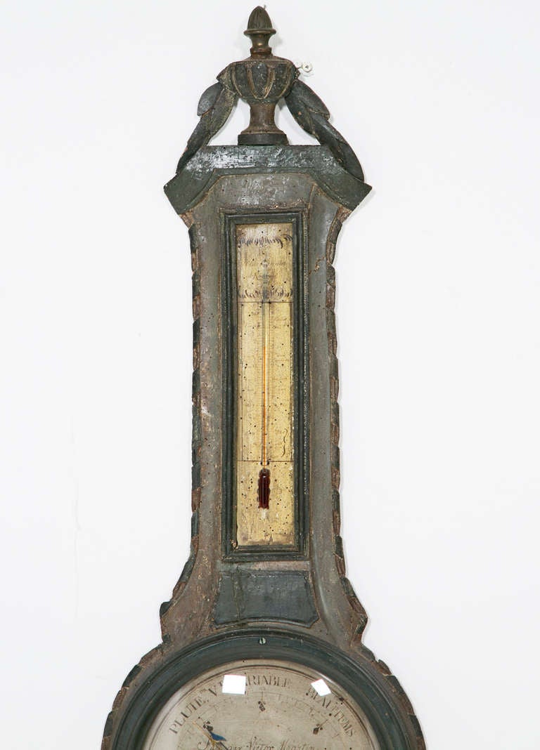 A Louis XVI style barometer in carved pine with painted finish. In working condition. Provincial example made on the continent near France about 1830. A nice understated piece.