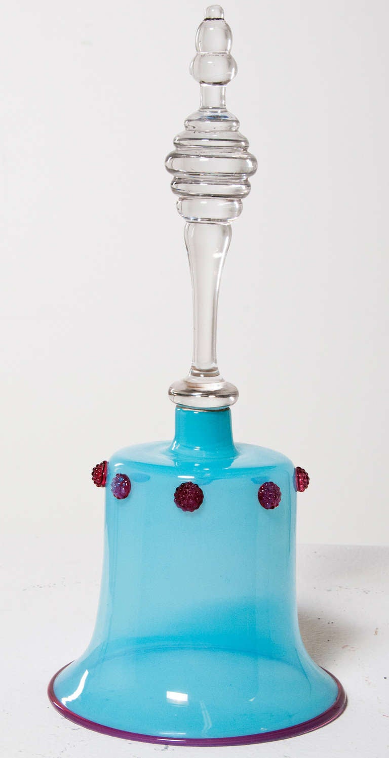 This aqua Opaline bell with raspberry color lip and raspberry color bosses continuing to a clear handle with knopped top is of the William IV period.