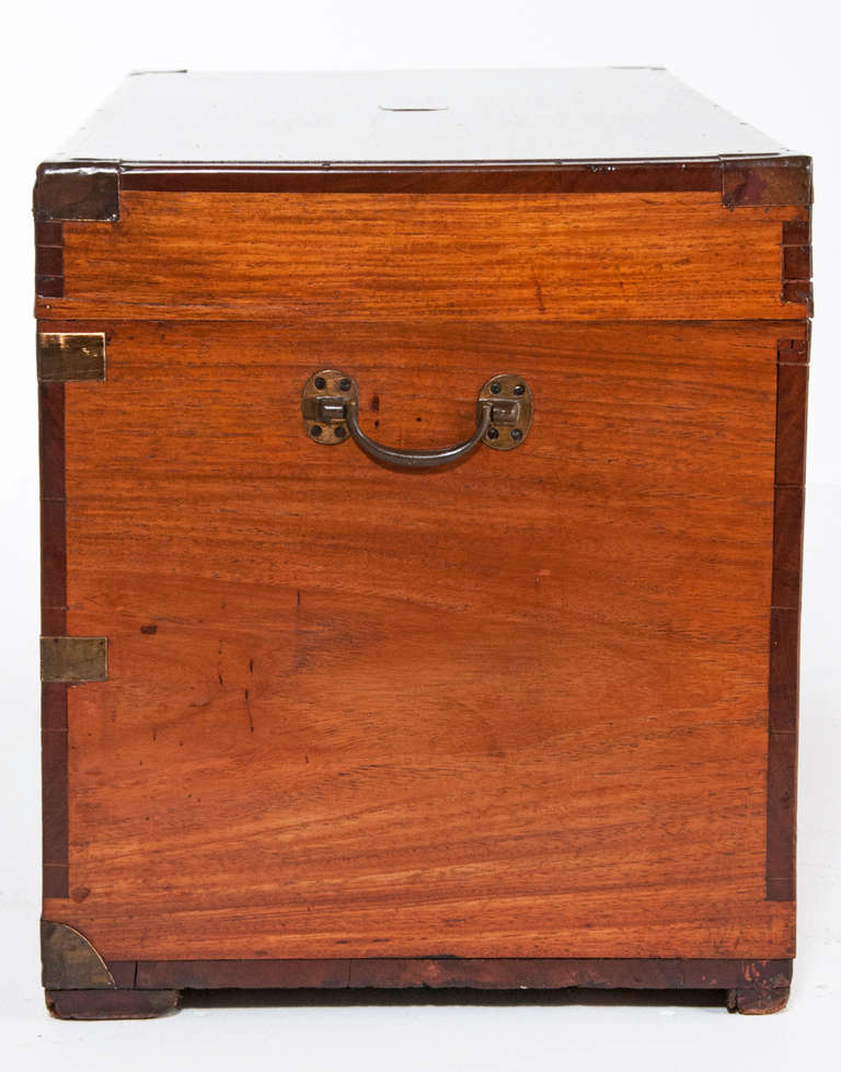 A rare hardwood campaign trunk made in China for export to UK during the 19th century. We love the rich color, well figured wood and brass fittings. We date this trunk to about 1880. Great as a coffee table or side table. Wonderful storage.