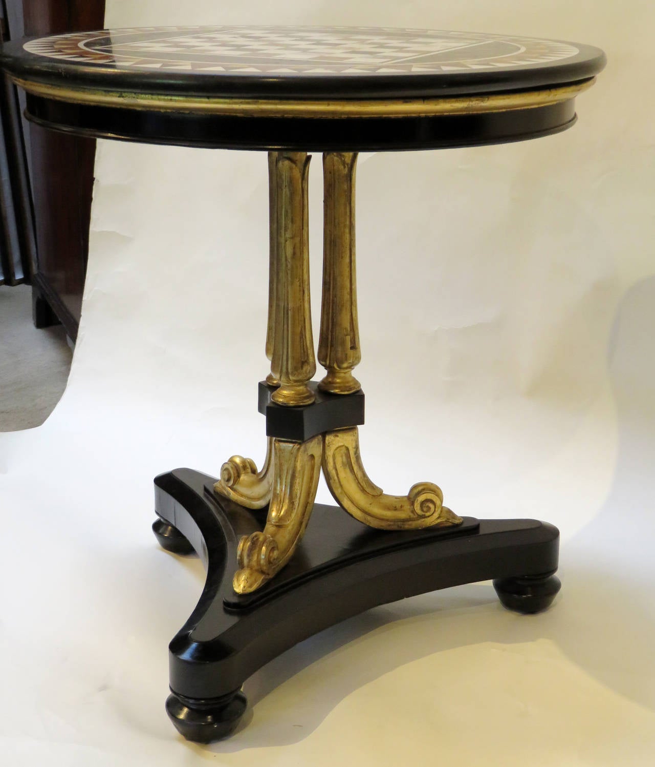 A very nice English Regency period ebonized and gilt pedestal table with associated Italian specimen marble top. Condition: Wear to surfaces. Small veneer repairs. Made in England, circa 1820. Great as a game table. A very nice center table in a