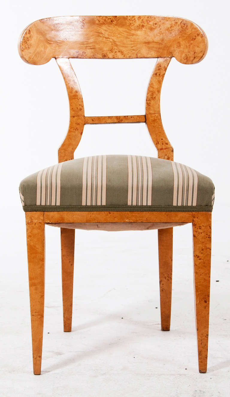 A 19th Century Russian Karelian birch Biedermeier side chair. Karelian birch is prized for its color and rich figuring, as you can see in this chairs. It is a wonderful accent chair to be used in any room of your home. Karelian birch is from the