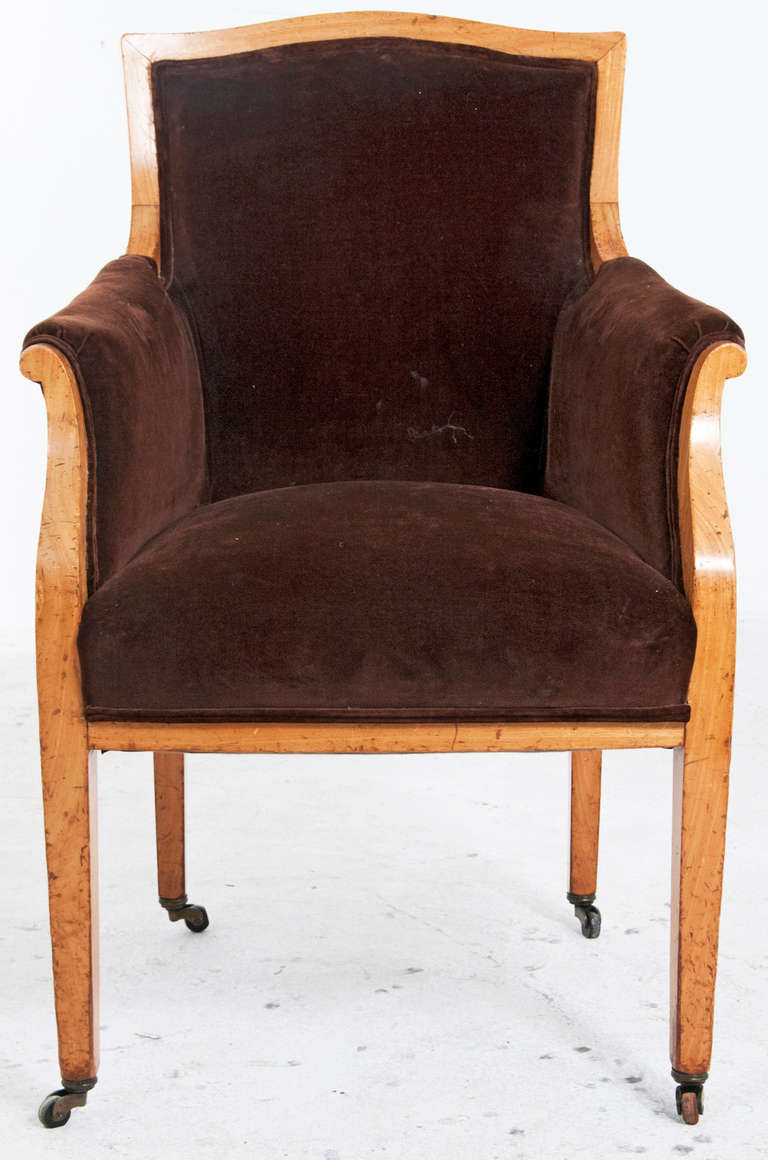 The restrained and elegant design suggest this great pair of armchairs was made in Northern Europe during the second quarter of the 19th century.  They are comfortable.  Easily moved on casters and scaled for contemporary interiors.  The design was