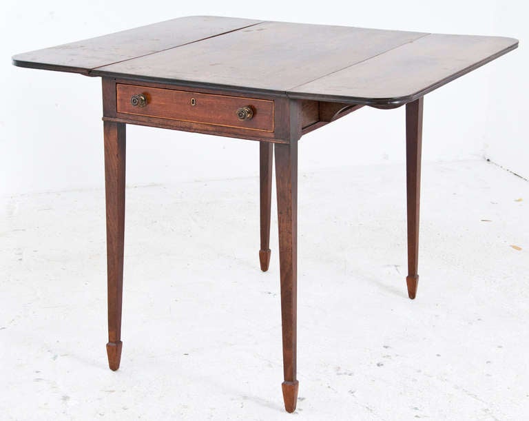 A nice example of an English Pembroke table named for the early of Pembroke that supposedly ordered the first example of this useful and flexible table. First examples date to circa 1760 and are often created to Thomas Chippendale designs. This one