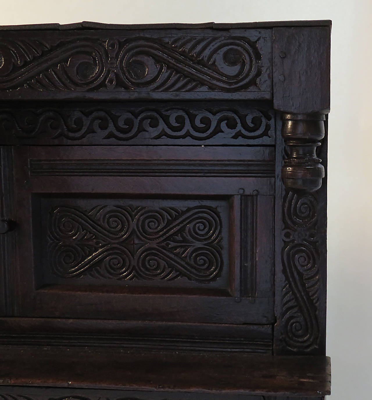 An unusually large and well carved English oak court cupboard made during the last quarter of the 17th century. The wonderful carvings appear to be original and suggest the piece originated in the Northern part of the country. From a collection