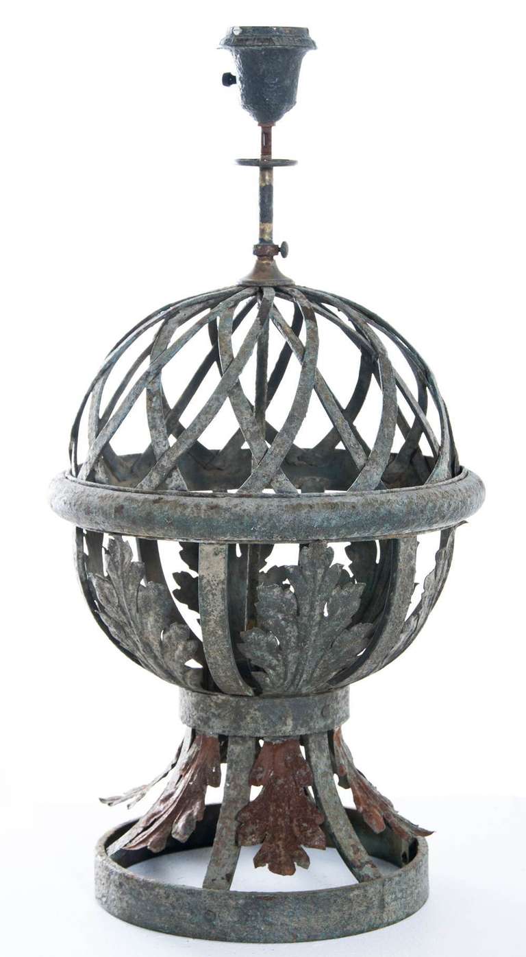A beautiful and large forged iron and painted gate post finial now mounted as a lamp. We think it is probably from France and was made during the last part of the 19th century. Great old painted surface. Wonderful architectural detail.
