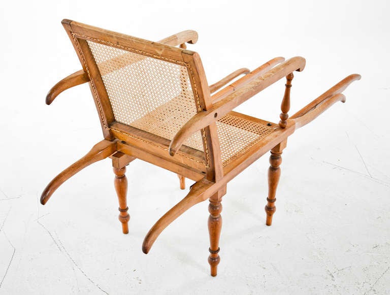 A classic 19th century Anglo English plantation or sedan chair.  These chairs where made to carry people.  Four people would take hold of the chair in each corner.  We have only seen a couple. in 30 years.  A real rarity.