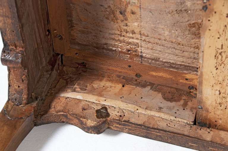 A 19th Century Italian burled walnut writing or game table with one drawer. Standing on modified cabriole legs. With good color and a nice older surface. This flexible piece is beautifully finished on all four sides so it would stand nicely away