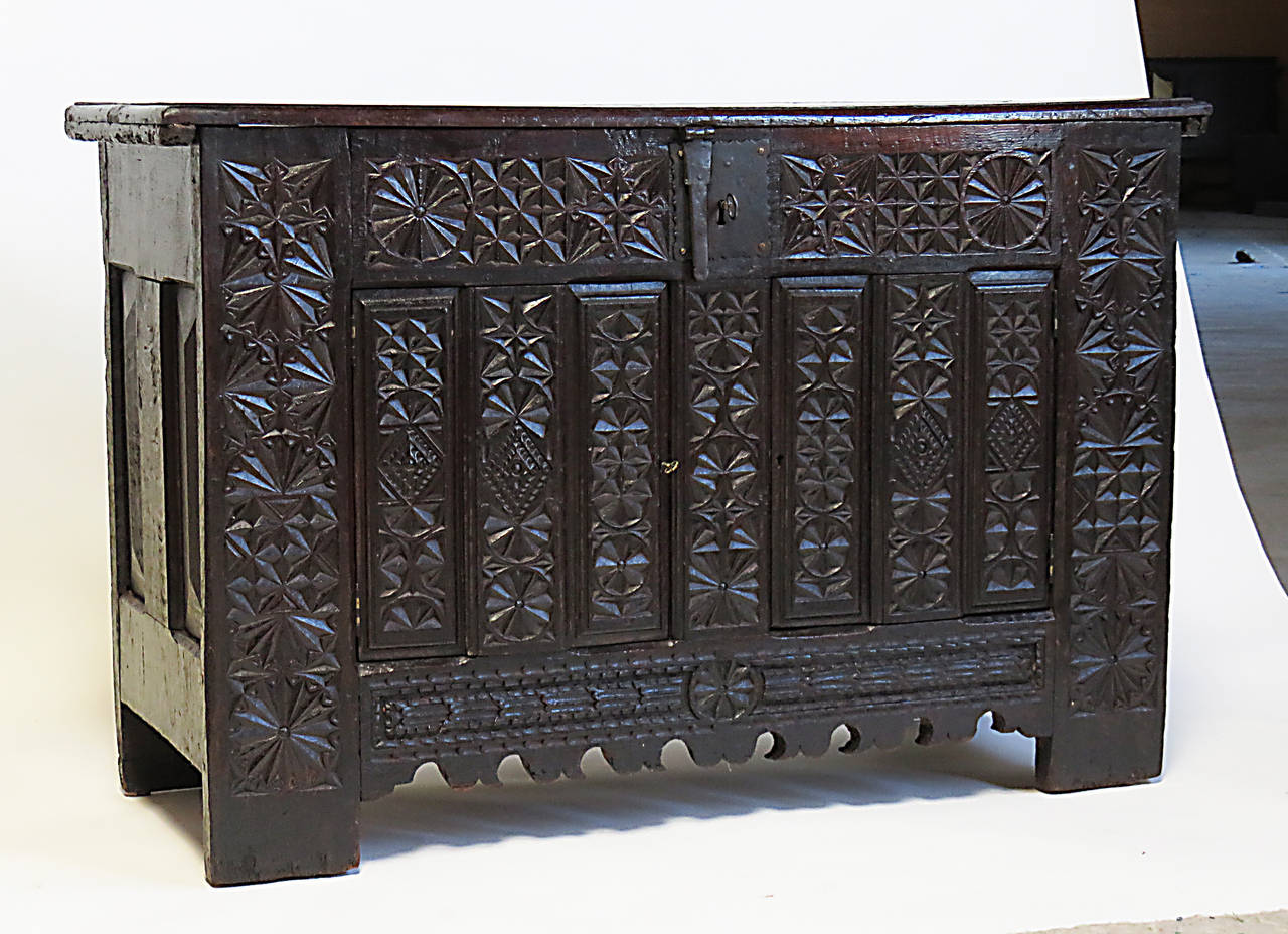 A large and well carved Basque dowry chest or coffer in oak with what looks like the original finish. We believe this piece dates to about 1680 and was made in Northern Spain. This piece comes to us from a very old East Coast collection assembled by