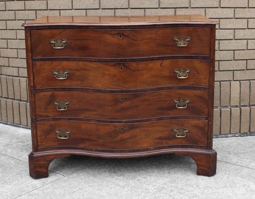 A very elegant well figured mahogany serpentine chest of drawers made about 200 years ago.  This chest is attributed to Langley Boardman that worked in and around Portsmouth.