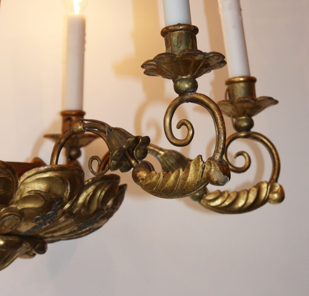 A fantastic 19th century Italian giltwood six-light chandelier.
