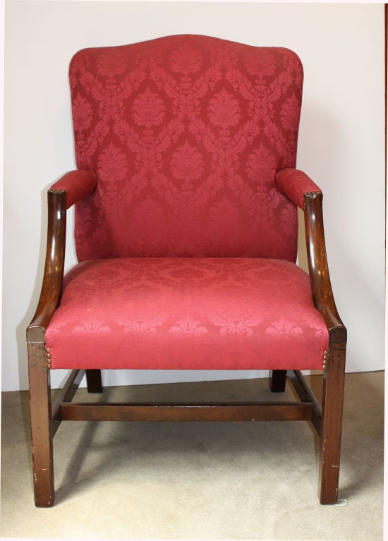 A handsome and elegant 18th century mahogany George III period library or Gainsborough chair. Great proportions with nice color and graceful shaped back and arms. This piece was probably made in the North Country and is slightly Provincial.
