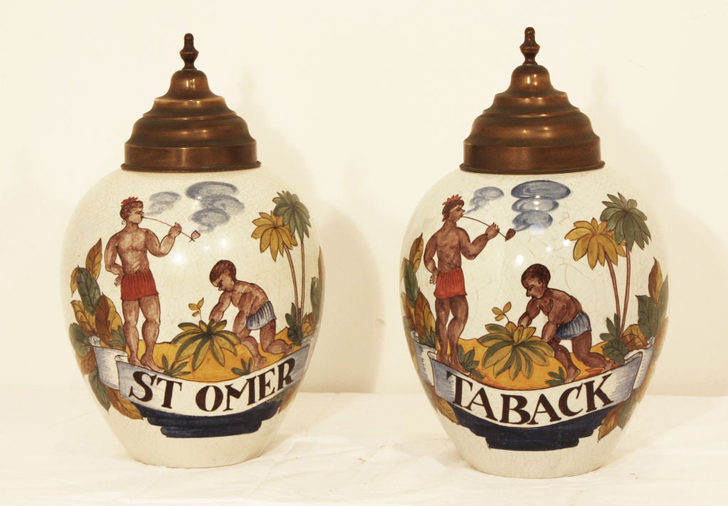 I wish these where original but they are a very nice pair of faience tobacco jars probably by Mottaheda in the 18th century style.  These would be great as lamps
