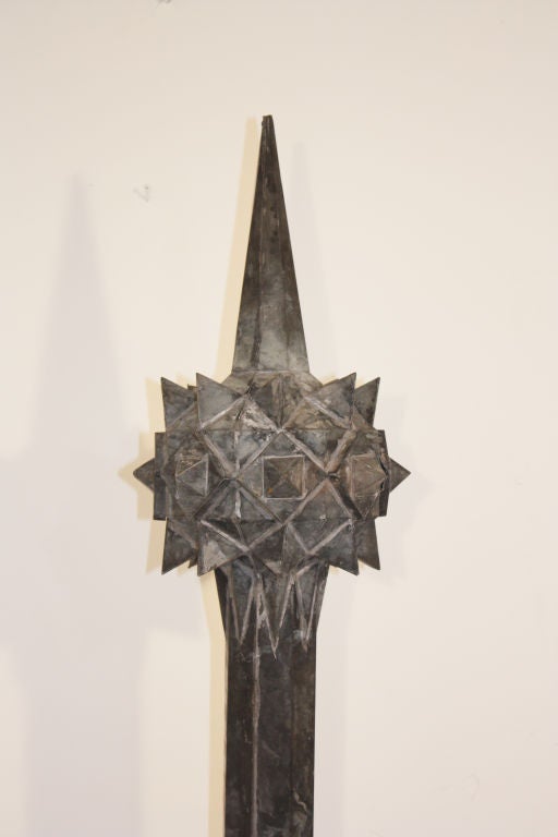 A great looking 19th century zinc finial on a grey painted wooden stand.  The finial is almost futuristic featuring a geometric spiked sphere.  This piece is good size and very decorative.