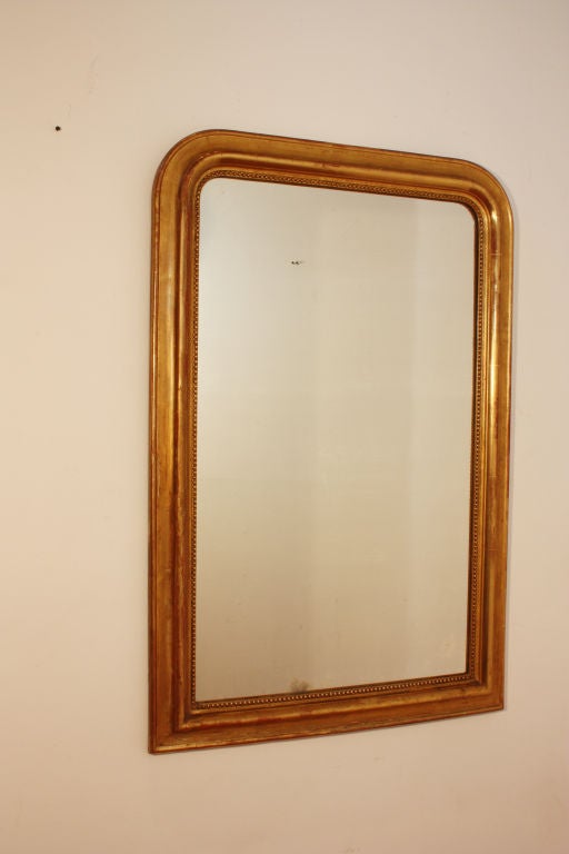 A very nice Louis Philippe period giltwood mirror made in France during the 19th century.  The wood and gesso frame features deeply carved moldings.  The gilded surface is particularly nice. Less than 2% of our inventory is shown here please contact