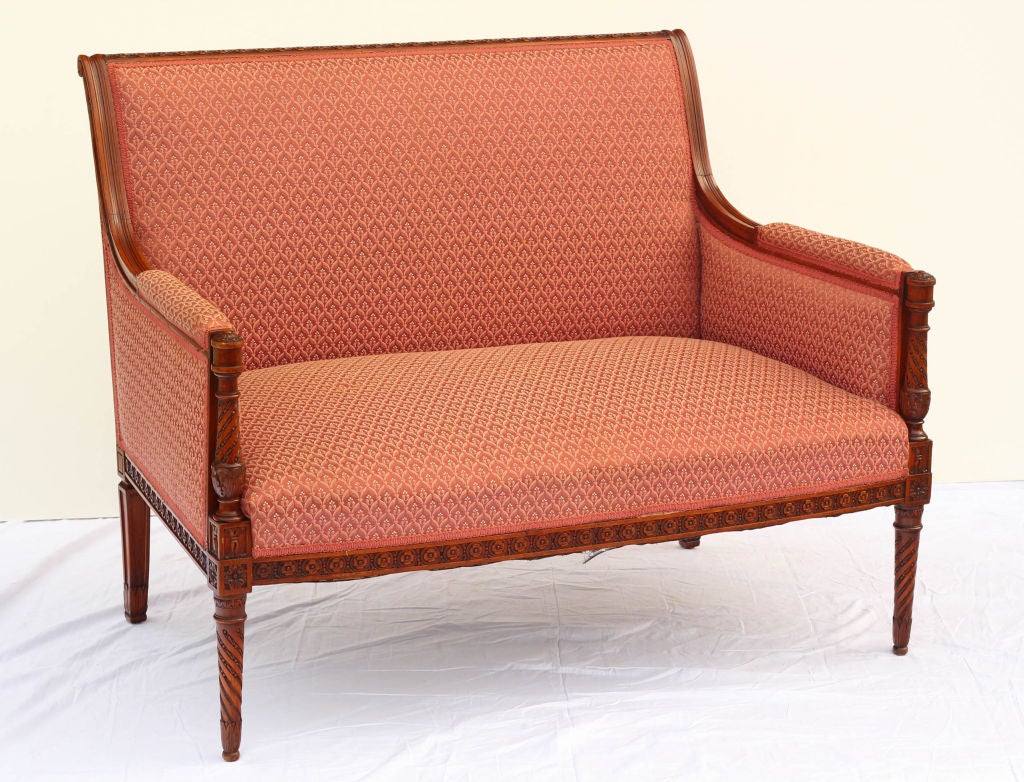 A nicely carved and scaled Louis XVI style beechwood canape / settee made in France early in the 20th century.
