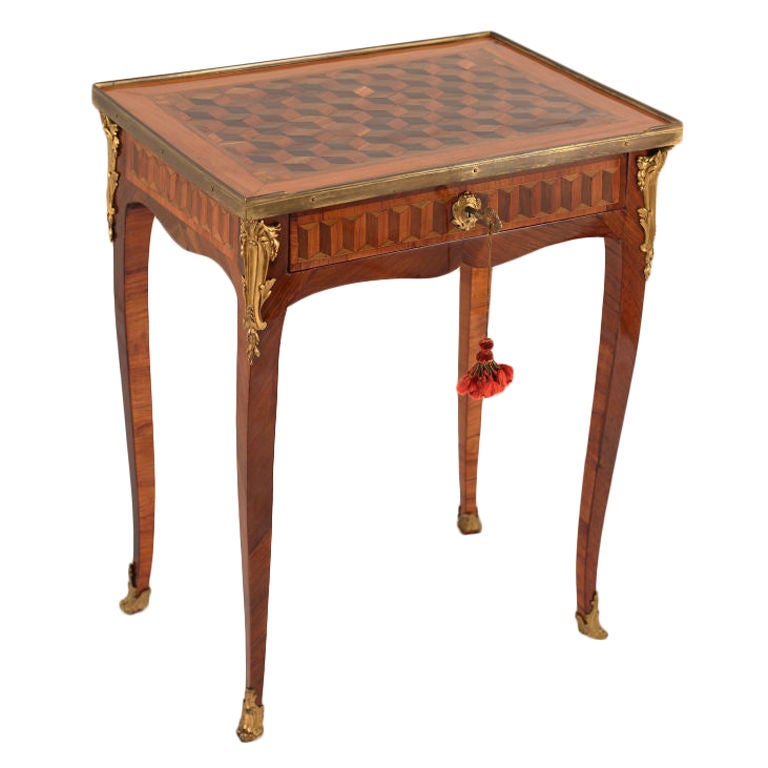 Transitional Swedish writing table in exceptional condition with cube parquetry and well defined gilt bronze mounts.