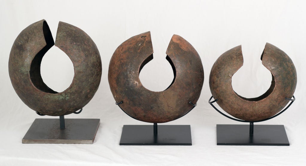 Various sizes of African bronze currency used in trade.  Now on custom stands. Price is for each.